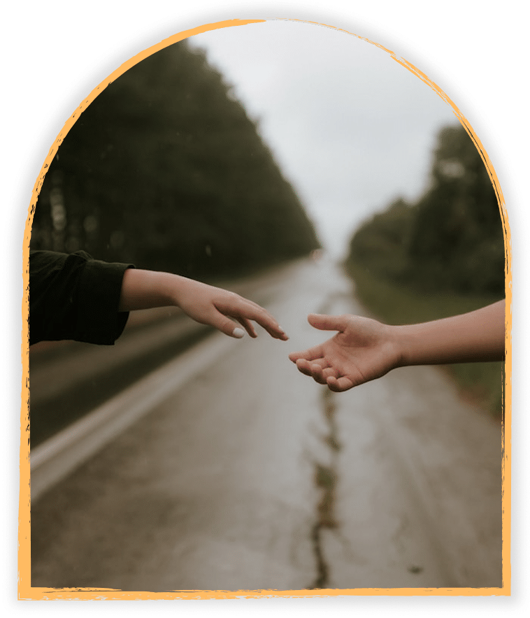 a photo of reaching hands on a rainy road symbolize connection