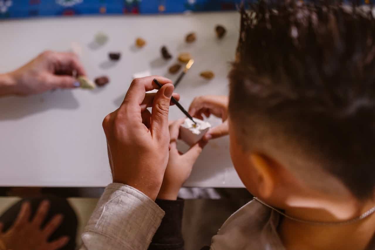 Child completing hands-on activities during pediatric neuropsychological testing with a clinician